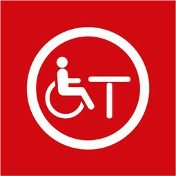 Vergrößerte Ansicht von Hier ist ein Symbol, das für die Möblierung/Bestuhlung für gehbehinderte oder auf den Rollstuhl angewiesene Menschen steht. Der Hintergrund ist ein rotes Quadrat. Das Bild stellt symbolisch dar:  -	Eine Person, die im Rollstuhl vor einem unterfahrbaren Tisch sitzt 