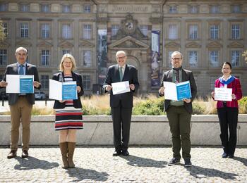 Mint.con-Bescheidübergabe